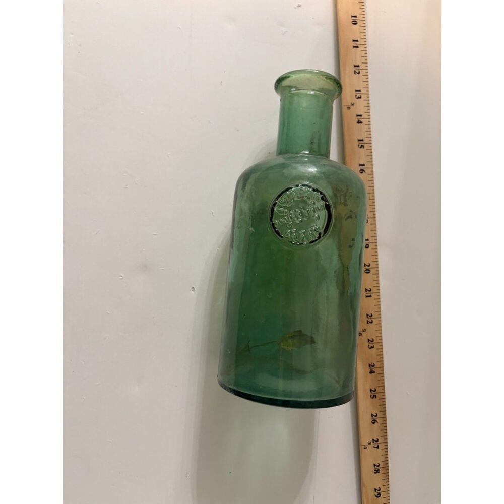 vtg Green glass bottle with embossed seal